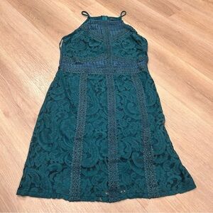 Suzy Sheer green sleeveless dress